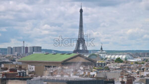 VIDEO Distant view of the Eiffel Tower with buildings surrounding it in Paris, France - Starpik