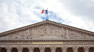 VIDEO French flag waving on the facade of the Palais Bourbon, Paris, France - Starpik