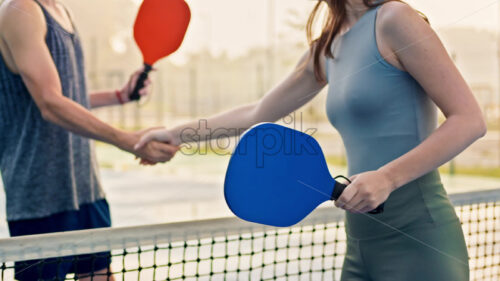 VIDEO Man and woman doing a secret handshake after playing pickleball after rain - Starpik