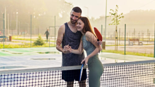 VIDEO Man and woman doing a secret handshake after playing pickleball after rain - Starpik