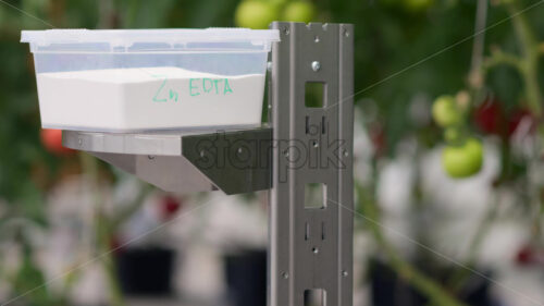 VIDEO Mobile robotics station moving near rows of tomatoes in a greenhouse farm - Starpik