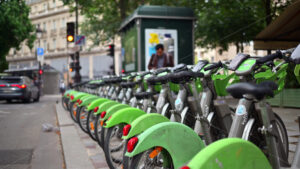 VIDEO Paris, France – June 18, 2024: Green electric bikes parked on the street - Starpik