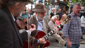 VIDEO Paris, France – June 18, 2024: Men singing and playing instruments on the street - Starpik