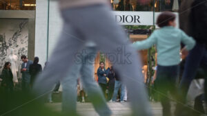 VIDEO Paris, France – June 18, 2024: People passing in front of the Christian Dior store - Starpik