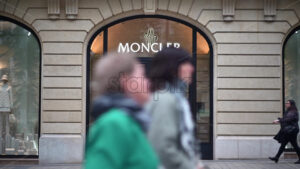 VIDEO Paris, France – June 18, 2024: People passing in front of the Yves Saint Laurent store - Starpik