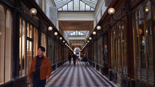 VIDEO Paris, France – June 18, 2024: People walking through Galerie V√©ro-Dodat - Starpik