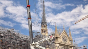 VIDEO Paris, France – June 18, 2024: The Cathedrale Notre-Dame de Paris under reconstruction with the blue sky on the background - Starpik