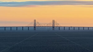 VIDEO – Aerial drone view of the Oresund Bridge cable-stayed bridge across the Oresund strait between Denmark and Sweden - Starpik