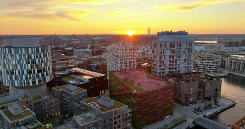 VIDEO Aerial drone view of Nordhavn harbour area at the coast of the Oresund at sunset - Starpik