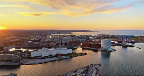 VIDEO Aerial drone view of Nordhavn harbour area at the coast of the Oresund at sunset - Starpik