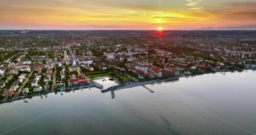 VIDEO Aerial drone view of Osterbo Nord, Nordhavn harbour area at the coast of the Oresund at sunset - Starpik