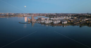 VIDEO Aerial drone view of Osterbo Nord, Nordhavn harbour area at the coast of the Oresund in the evening - Starpik