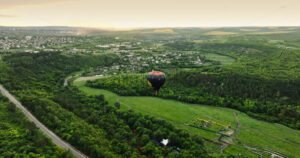 VIDEO Aerial drone view of a hot air balloon flying above Chisinau, Moldova - Starpik