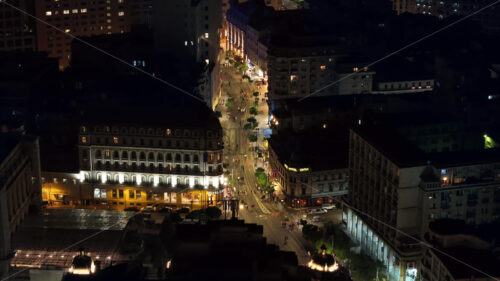 VIDEO Aerial drone view of people walking on the streets of Bucharest, Romania at night - Starpik