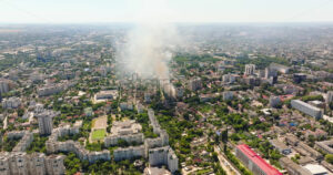 VIDEO Aerial drone view of smoke coming out of a building in Chisinau, Moldova - Starpik