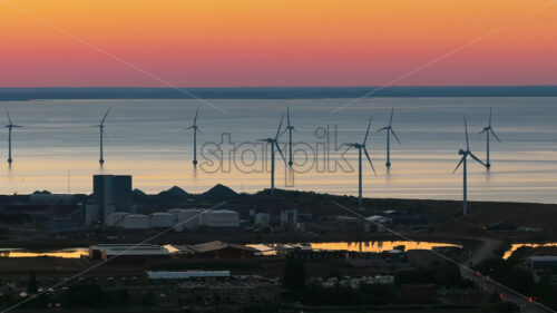 VIDEO Aerial drone view of the Middelgrunden wind farm outside Copenhagen, Denmark at sunset - Starpik