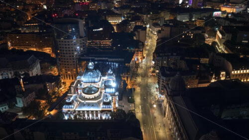 VIDEO Aerial drone view of the Palace of the Deposits and Consignments illuminated in Bucharest, Romania at night - Starpik