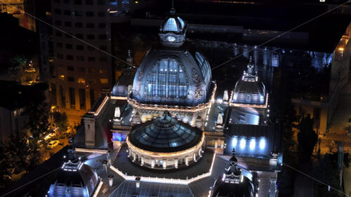 VIDEO Aerial drone view of the Palace of the Deposits and Consignments illuminated in Bucharest, Romania at night - Starpik