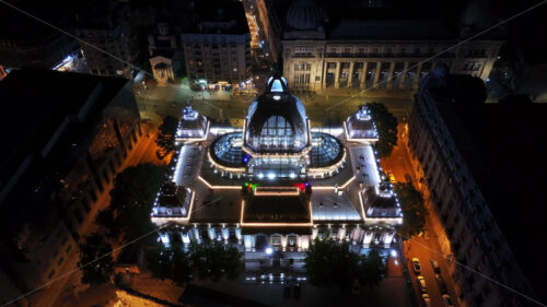 VIDEO Aerial drone view of the Palace of the Deposits and Consignments illuminated in Bucharest, Romania at night - Starpik