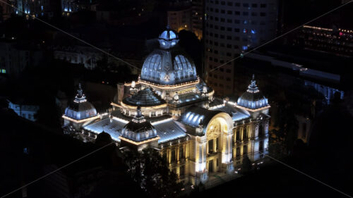 VIDEO Aerial drone view of the Palace of the Deposits and Consignments illuminated in Bucharest, Romania at night - Starpik