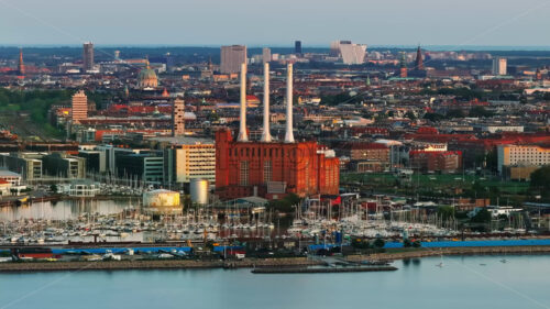 VIDEO Aerial drone view of the Svanemolle Power Station in the south side of Svanemolle Bay in Nordhavnen, Copenhagen, Denmark - Starpik