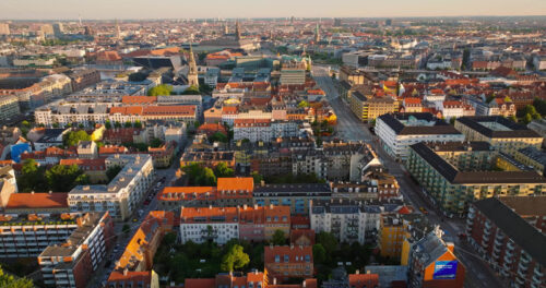 VIDEO Aerial drone view of the city centre of Copenhagen, Denmark at sunset - Starpik