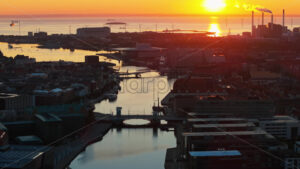 VIDEO Aerial drone view of the city centre of Copenhagen harbour in Denmark at sunset - Starpik