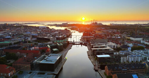 VIDEO Aerial drone view of the city centre of Copenhagen harbour in Denmark at sunset - Starpik