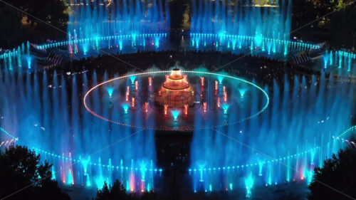 VIDEO Aerial drone view of the illuminated Bucharest fountains in Romania, at night - Starpik