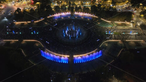 VIDEO Aerial drone view of the illuminated Bucharest fountains in Romania, at night - Starpik