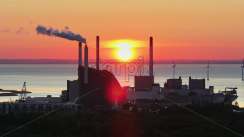 VIDEO Copenhagen, Denmark – July 24, 2024: Aerial drone view of Amager Bakke in Amager at sunset - Starpik