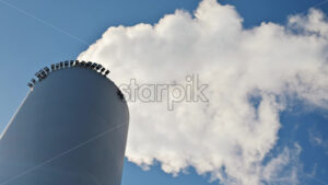 VIDEO Low angle view of smoke coming out of the Amager Bakke in Amager, Copenhagen Denmark - Starpik