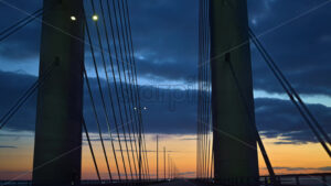 VIDEO View of the Oresund Bridge cable-stayed bridge across the Oresund strait between Denmark and Sweden at sunset - Starpik