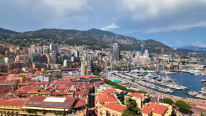 Royalty free stock video Aerial view of white boats docked in the Monaco Marina with the skyline on the background - Starpik