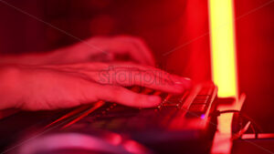 Royalty free stock video Close up of a man trying to fix an error on a computer in a server room - Starpik