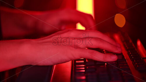 Royalty free stock video Close up of a man trying to fix an error on a computer in a server room - Starpik