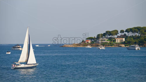 Royalty free stock video White boats moving on the sea in Antibes, France - Starpik