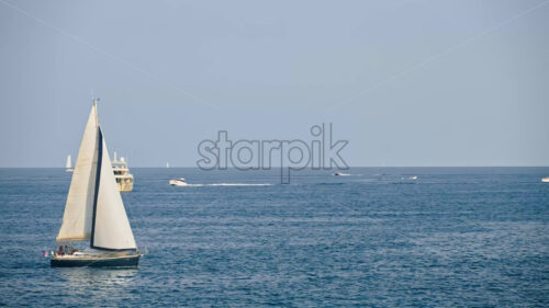 Royalty free stock video White boats moving on the sea in Antibes, France - Starpik