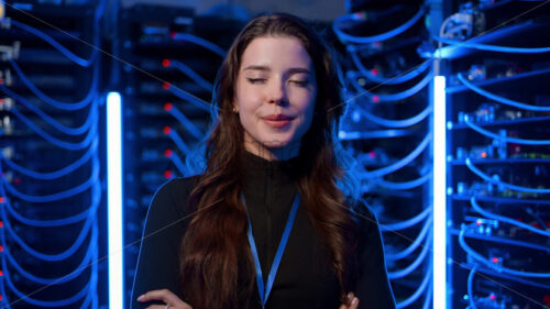 Royalty free stock video Woman standing in a server room - Starpik