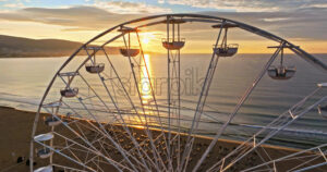 Royalty free video Aerial drone view of a ferris wheel Sunny Beach resort in Bulgaria at sunset - Starpik