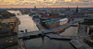 Video Aerial drone view of Borsen historical place in Copenhagen, Denmark at night - Starpik