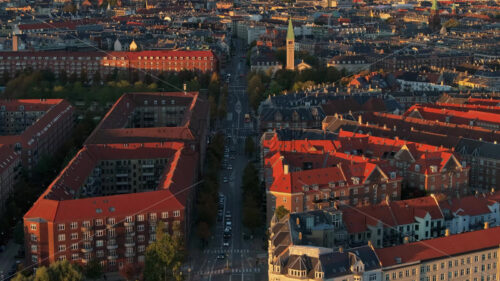 Video Aerial drone view of Vesterbro district in Copenhagen, Denmark at sunset - Starpik