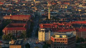 Video Aerial drone view of Vesterbro district in Copenhagen, Denmark at sunset - Starpik