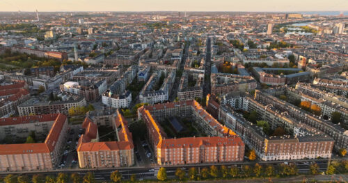 Video Aerial drone view of Vesterbro district in Copenhagen, Denmark at sunset - Starpik