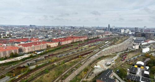 Video Aerial drone view of Vesterbro district in Copenhagen, Denmark on a cloudy day - Starpik