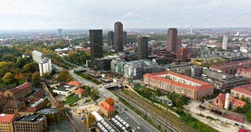 Video Aerial drone view of Vesterbro district in Copenhagen, Denmark on a cloudy day - Starpik