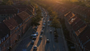 Video Aerial drone view of cars moving on the streets of Vesterbro district in Copenhagen, Denmark at sunset - Starpik