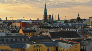 Video Aerial drone view of the Christiansborg Palace on the islet of Slotsholmen in central Copenhagen, Denmark at sunset - Starpik