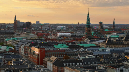 Video Aerial drone view of the Christiansborg Palace on the islet of Slotsholmen in central Copenhagen, Denmark at sunset - Starpik