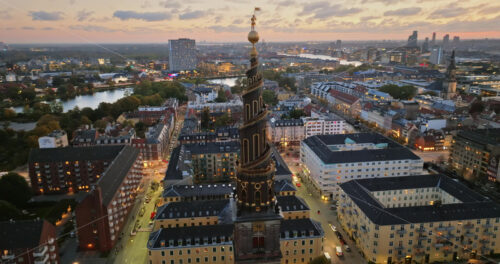 Video Aerial drone view of the Church of Our Saviour in the city centre of Copenhagen, Denmark at night - Starpik